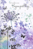 This sympathy card unfolds like a soft-spoken scene from the countryside around North Ockendon, where the land feels wide and the air unhurried. From the base of the design, tall, slender wildflower stems rise in loose clusters, each crowned with fine, umbel-shaped blooms painted in shades of lavender, indigo, and gentle blue. The flower heads are drawn with a lace-like touch, their outlines fading at the tips so they seem to shimmer against the background, as if moving slightly in a barely-there breeze. Behind them, a wash of watercolour purples and silvery greens flows together, echoing the quiet haze that sometimes lingers over nearby fields and hedgerows near Pike Lane at dawn or dusk. Dainty butterflies hover among the stems, rendered with translucent wings and the lightest shadowing, suggesting the idea of transformation and continued presence rather than departure. The whole composition is calm and uncluttered, with no bold borders or heavy lines, allowing the eye to wander gently across the page. The atmosphere is one of contemplation-a quiet space where grief is acknowledged but not rushed. As a local florist who often prepares funeral tributes for North Ockendon families, I recognise in this design the same intention we bring to sympathy flowers: to offer comfort without intrusion, beauty without spectacle, and a subtle reminder that love and memory remain, even when the world feels changed beyond words.